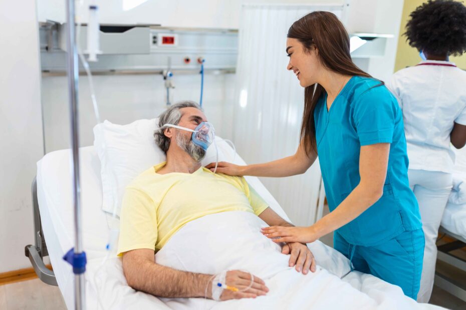 A dynamic image of a nurse (ideally resembling John Mugo) caring for a patient in a hospital setting.